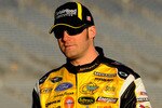 ATLANTA - MARCH 05:  Paul Menard, driver of the #98 Menard's Ford, walks down pit road during qualifying for the NASCAR Sprint Cup Series Kobalt Tools 500 at Atlanta Motor Speedway on March 5, 2010 in Hampton, Georgia.  (Photo by John Harrelson/Getty Images)