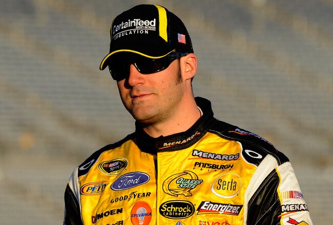ATLANTA - MARCH 05:  Paul Menard, driver of the #98 Menard's Ford, walks down pit road during qualifying for the NASCAR Sprint Cup Series Kobalt Tools 500 at Atlanta Motor Speedway on March 5, 2010 in Hampton, Georgia.  (Photo by John Harrelson/Getty Images)