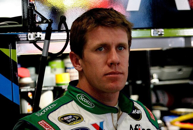 ATLANTA - MARCH 05:  Carl Edwards, driver of the #99 Scotts Ford, stands in the garage during practice for the NASCAR Sprint Cup Series Kobalt Tools 500 at Atlanta Motor Speedway on March 5, 2010 in Hampton, Georgia.  (Photo by Tom Whitmore/Getty Images for NASCAR)