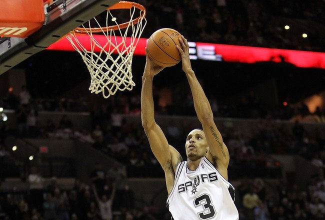 SAN ANTONIO - JANUARY 22:  Guard George Hill #3 of the San Antonio Spurs gets the slam dunk against the Houston Rockets at AT&T Center on January 22, 2010 in San Antonio, Texas.  (Photo by Ronald Martinez/Getty Images)