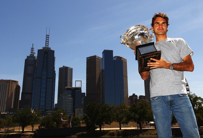 MELBOURNE, AUSTRALIA - FEBRUARY 01:  Roger Federer of Switzerland poses with the Australian Open 2010 winners trophy on Boathouse Drive on February 1, 2010 in Melbourne, Australia.  (Photo by Mark Dadswell/Getty Images)