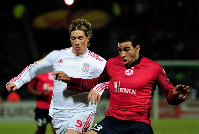 LILLE, FRANCE - MARCH 11:  Fernando Torres of Liverpool is challenges Adil Rami of Lille during the UEFA Europa League last 16, 1st leg match between Lille and  Liverpool on March 11, 2010 in Lille, France.  (Photo by Mike Hewitt/Getty Images)