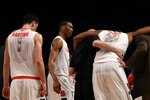 NEW YORK - MARCH 11: Arinze Onuaku #21 of the Syracuse Orange is helped off the court after being injured late in the game against the Georgetown Hoyas during the quarterfinal of the 2010 NCAA Big East Tournament at Madison Square Garden on March 11, 2010 in New York City.  (Photo by Chris Trotman/Getty Images)
