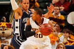INDIANAPOLIS - MARCH 11:  Guard Lawrence Westbrook #20 of the Minnesota Golden Gophers controls the ball as he is defended by guard Chris Babb #10 of the Penn State Nittany Lion during the first round of the Big Ten Men's Basketball Tournament at Conseco Fieldhouse on March 11, 2010 in Indianapolis, Indiana.  (Photo by Jonathan Daniel/Getty Images)