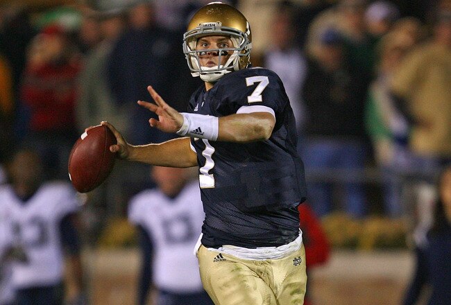 SOUTH BEND, IN - NOVEMBER 21: Jimmy Clausen #7 of the Notre Dame Fighting Irish looks for a receiver in the first overtime period against the Univeristy of Connecticut Huskies at Notre Dame Stadium on November 21, 2009 in South Bend, Indiana. Connecticut defeated Notre Dame 33-30 in double overtime. (Photo by Jonathan Daniel/Getty Images)