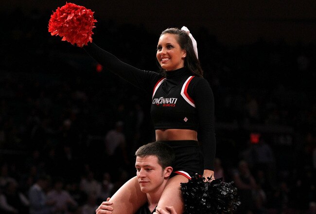 NEW YORK - MARCH 10: The Cincinnati Bearcats cheerleaders perform against the Louisville Cardinals during the second round of 2010 NCAA Big East Tournament at Madison Square Garden on March 10, 2010 in New York City.  (Photo by Jim McIsaac/Getty Images)