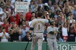 BOSTON - JULY 6: Nomar Garciaparra #1 of the Oakland Athletics tips his hat to the crowds applause during his first return to Fenway Park against the Boston Red Sox on July 6, 2009 in Boston, Massachusetts. (Photo by Elsa/Getty Images)