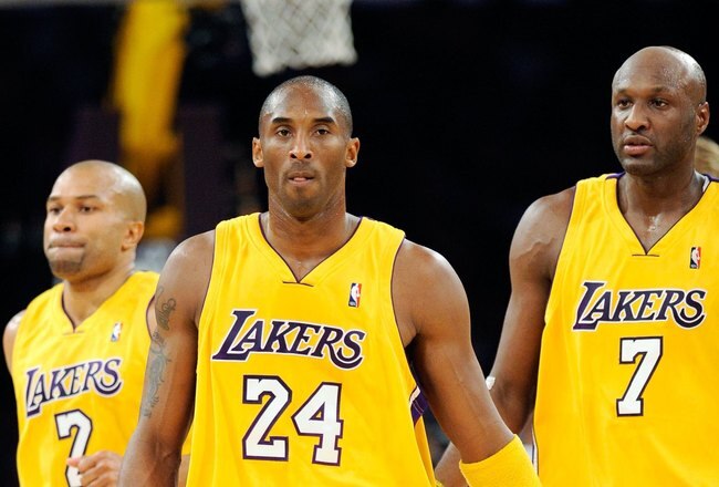 LOS ANGELES, CA - OCTOBER 30:  Kobe Bryant #24 Derek Fisher #2 and Lamar Odom of the Los Angeles Lakers walk to the bench during a time out against Dallas Mavericks during the NBA basketball game at Staples Center on October 30, 2009 in Los Angeles, California.  NOTE TO USER: User expressly acknowledges and agrees that, by downloading and/or using this Photograph, user is consenting to the terms and conditions of the Getty Images License Agreement.  (Photo by Kevork Djansezian/Getty Images)
