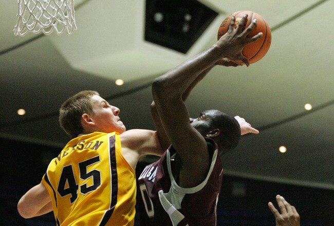 ANAHEIM, CA - NOVEMBER 29:  Bryan Davis #00 of Texas A&M puts up a shot against Colton Iverson #45 of Minnesota in the 76 Classic at Anaheim Convention Center on November 29, 2009 in Anaheim, California. Texas A&M defeated Minnesota 66-65. (Photo by Victor Decolongon/Getty Images)