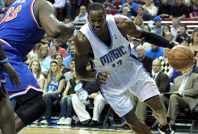 ORLANDO, FL - FEBRUARY 21:  Dwight Howard #12 of the Orlando Magic drives against Shaquille O'Neal #33 of the Cleveland Cavaliers at Amway Arena on February 21, 2010 in Orlando, Florida. NOTE TO USER: User expressly acknowledges and agrees that, by downloading and/or using this Photograph, user is consenting to the terms and conditions of the Getty Images License Agreement.  (Photo by Sam Greenwood/Getty Images)