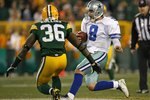 GREEN BAY, WI - NOVEMBER 15: Tony Romo #8 of the Dallas Cowboys runs for a first down as Nick Collins #36 of the Green Bay Packers closes in at Lambeau Field on November 15, 2009 in Green Bay, Wisconsin. The Packers defeated the Cowboys 17-7. (Photo by Jonathan Daniel/Getty Images)