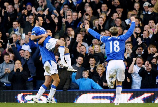 LIVERPOOL, ENGLAND - MARCH 07: Landon Donovan of Everton is lifted in the air by Jack Rodwell after scoring the fourth goal during the Barclays Premier League match between Everton and Hull City at Goodison Park on March 7, 2010 in Liverpool, England.  (Photo by Laurence Griffiths/Getty Images)