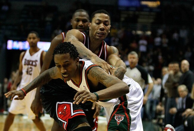 MILWAUKEE - NOVEMBER 30: Brandon Jennings #3 of the Milwuakee Bucks gets fouled in the closing minute by Derrick Rose #1 of the Chicago Bulls at the Bradley Center on November 30, 2009 in Milwaukee, Wisconsin. The Bucks defeated the Bulls 99-97. NOTE TO USER: User expressly acknowledges and agrees that, by downloading and/or using this Photograph, User is consenting to the terms and conditions of the Getty Images License Agreement. (Photo by Jonathan Daniel/Getty Images)