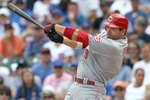 CHICAGO - JULY 26: Joey Votto #19 of the Cincinnati Reds makes a hit during the game against the Chicago Cubs on July 26, 2009 at Wrigley Field in Chicago, Illinois. (Photo by Jonathan Daniel/Getty Images) 