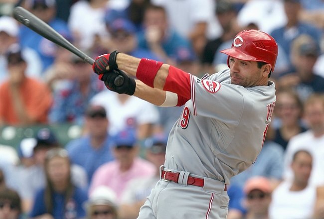 CHICAGO - JULY 26: Joey Votto #19 of the Cincinnati Reds makes a hit during the game against the Chicago Cubs on July 26, 2009 at Wrigley Field in Chicago, Illinois. (Photo by Jonathan Daniel/Getty Images) 