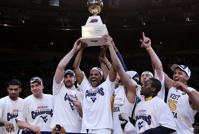 NEW YORK - MARCH 13:  Devin Ebanks and the West Virginia Mountaineers celebrate with the trophy after defeating the Georgetown Hoyas in the championship of the 2010 NCAA Big East Tournament at Madison Square Garden on March 13, 2010 in New York City.  (Photo by Jim McIsaac/Getty Images)