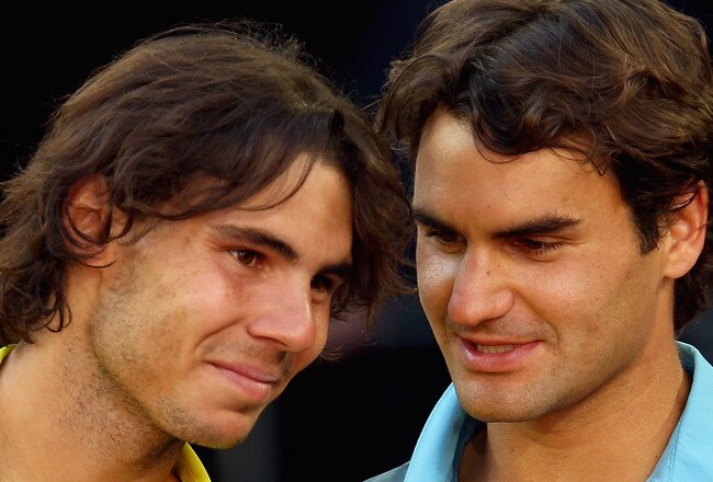 MADRID, SPAIN - MAY 17:  Roger Federer of Switzerland (R) and Rafael Nadal of Spain share a moment during the prize giving ceremony after the mens final during the Madrid Open tennis tournament at the Caja Magica on May 17, 2009 in Madrid, Spain.  (Photo by Clive Brunskill/Getty Images)