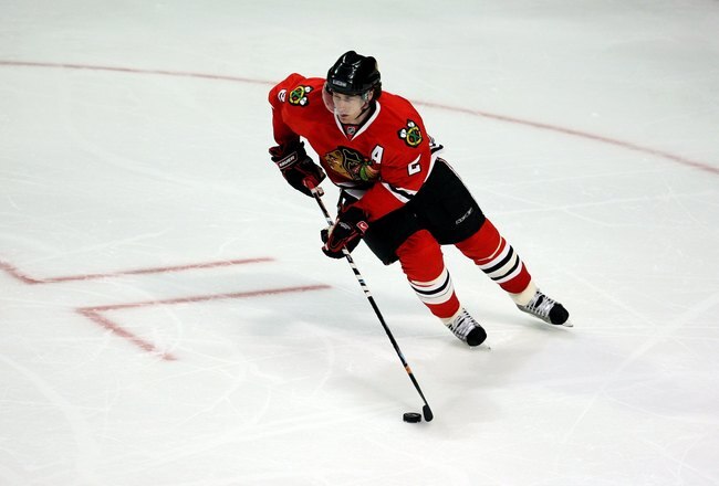 CHICAGO - MARCH 08:  Duncan Keith #2 of the Chicago Blackhawks skates with the puck against the Colorado Avalanche at the United Center on March 8, 2009 in Chicago, Illinois. The Avalanche won 5-1. (Photo by Jonathan Daniel/Getty Images)