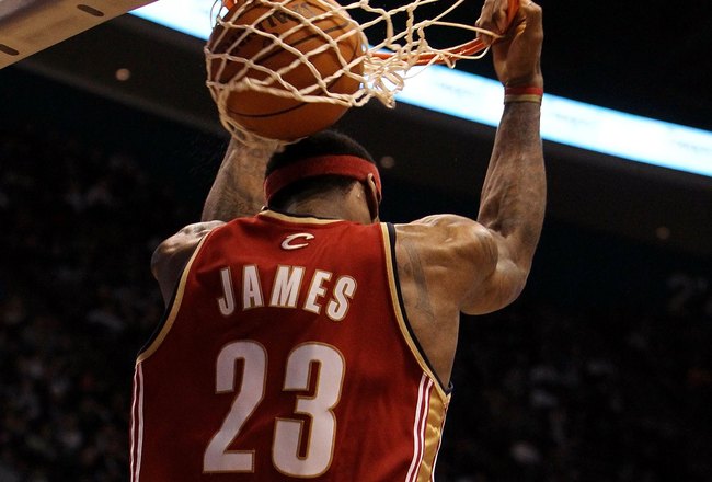 EAST RUTHERFORD, NJ - MARCH 03:  LeBron James #23 of the Cleveland Cavaliers dunks against the New Jersey Nets at the Izod Center on March 3, 2010 in East Rutherford, New Jersey.NOTE TO USER: User expressly acknowledges and agrees that, by downloading and or using this photograph, User is consenting to the terms and conditions of the Getty Images License Agreement.  (Photo by Jim McIsaac/Getty Images)