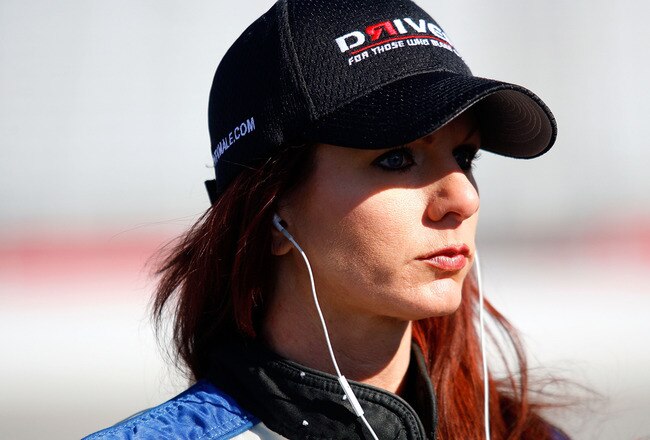 ATLANTA - MARCH 06:  Jennifer Jo Cobb, driver of the #10 JJC Racing Ford, stands on the grid during qualifying for the NASCAR Camping World Truck Series E-Z-GO 200 at Atlanta Motor Speedway on March 6, 2010 in Hampton, Georgia.  (Photo by Jason Smith/Getty Images)