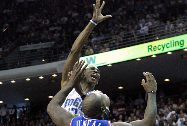 ORLANDO, FL - FEBRUARY 21: Dwight Howard #12 of the Orlando Magic attempts a shot over Shaquille O'Neal #33 of the Cleveland Cavaliers at Amway Arena on February 21, 2010 in Orlando, Florida. NOTE TO USER: User expressly acknowledges and agrees that, by downloading and/or using this Photograph, user is consenting to the terms and conditions of the Getty Images License Agreement.  (Photo by Sam Greenwood/Getty Images)