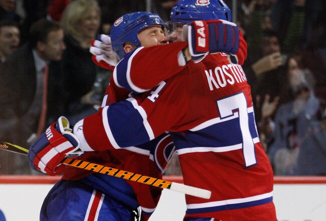 MONTREAL- NOVEMBER 24:  Glen Metropolit #15 celebrates his third period goal with Sergei Kostitsyn #74 of the Montreal Canadiens during the NHL game on November 24, 2009 at the Bell Centre in Montreal, Quebec, Canada.  The Canadiens defeated the Blue Jackets 5-3.  (Photo by Richard Wolowicz/Getty Images)