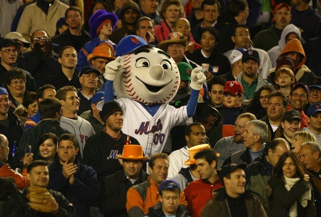 NEW YORK - OCTOBER 13:  Mr. Met of the New York Mets stands in the crowd during game two of the NLCS at Shea Stadium on October 13, 2006 in the Flushing neighborhood of the Queens borough of New York City.  (Photo by Al Bello/Getty Images)