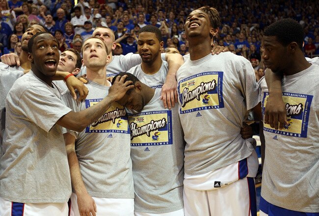 LAWRENCE, KS - MARCH 03:  Teammates watch career highlights and say goodbye to Sherron Collins #4 of the Kansas Jayhawks on Senior Day following his final home game against the Kansas State Wildcats on March 3, 2010 at Allen Fieldhouse in Lawrence, Kansas.  (Photo by Jamie Squire/Getty Images)