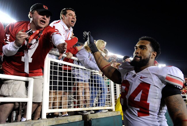 PASADENA, CA - JANUARY 01:  Defensive lineman Doug Worthington #84 of the Ohio State Buckeyes celebrates with fans after the Buckeyes 26-17 win over the Oregon Ducks in the 96th Rose Bowl game on January 1, 2010 in Pasadena, California.  (Photo by Kevork Djansezian/Getty Images)