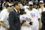 KANSAS CITY, MO - MARCH 13:  Head coach Bill Self of the Kansas Jayhawks congratulates Sherron Collins #4 after the Jayhawks defeated the Kansas State Wildcats to win the 2010 Phillips 66 Big 12 Men's Basketball Championship on March 13, 2010 at the Sprint Center in Kansas City, Missouri.  (Photo by Jamie Squire/Getty Images)