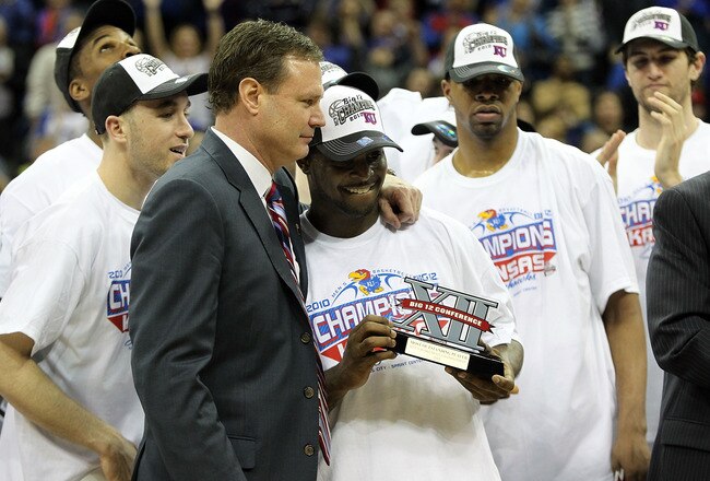 KANSAS CITY, MO - MARCH 13:  Head coach Bill Self of the Kansas Jayhawks congratulates Sherron Collins #4 after the Jayhawks defeated the Kansas State Wildcats to win the 2010 Phillips 66 Big 12 Men's Basketball Championship on March 13, 2010 at the Sprint Center in Kansas City, Missouri.  (Photo by Jamie Squire/Getty Images)