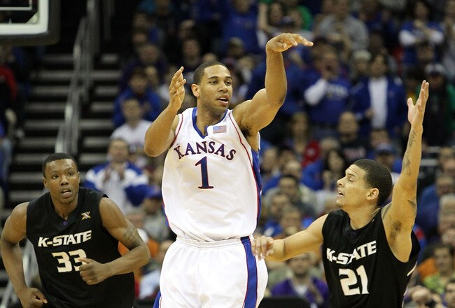 KANSAS CITY, MO - MARCH 13: Xavier Henry #1 of the Kansas Jayhawks passes as Wally Judge #33 and Denis Clemente #21 of the Kansas State Wildcats defend during the 2010 Phillips 66 Big 12 Men's Basketball Championship on March 13, 2010 at the Sprint Center in Kansas City, Missouri.  (Photo by Jamie Squire/Getty Images)