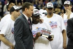 KANSAS CITY, MO - MARCH 13:  Head coach Bill Self of the Kansas Jayhawks congratulates Sherron Collins #4 after the Jayhawks defeated the Kansas State Wildcats to win the 2010 Phillips 66 Big 12 Men's Basketball Championship on March 13, 2010 at the Sprint Center in Kansas City, Missouri.  (Photo by Jamie Squire/Getty Images)