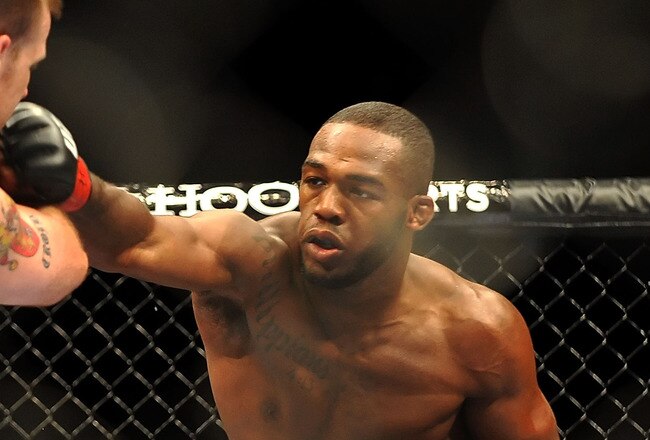 LAS VEGAS - JULY 11:  (R-L) Jon Jones connects with a right punch on Jake O'Brein during their light heavyweight bout during UFC 100 on July 11, 2009 in Las Vegas, Nevada. Jones defeated O'Brein by second round tapout.  (Photo by Jon Kopaloff/Getty Images)