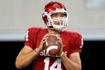 ARLINGTON, TX - SEPTEMBER 05:  Quarterback Sam Bradford #14 of the Oklahoma Sooners warms up before a game against the Brigham Young Cougars at Cowboys Stadium on September 5, 2009 in Arlington, Texas.  (Photo by Ronald Martinez/Getty Images)