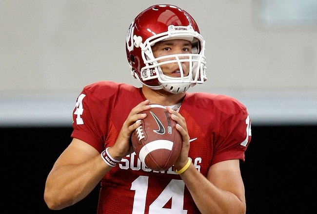 ARLINGTON, TX - SEPTEMBER 05:  Quarterback Sam Bradford #14 of the Oklahoma Sooners warms up before a game against the Brigham Young Cougars at Cowboys Stadium on September 5, 2009 in Arlington, Texas.  (Photo by Ronald Martinez/Getty Images)