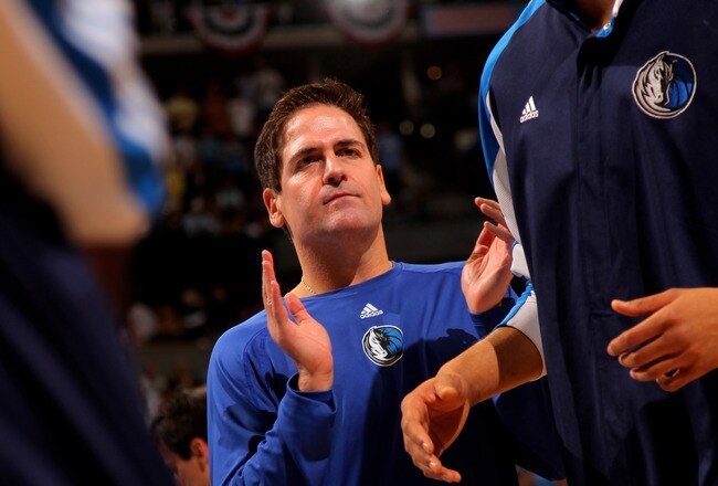 DENVER - MAY 05:  Mark Cuban, owner of the Dallas Mavericks, welcomes his team to the court during player introductions prior to facing the Denver Nuggets in Game Two of the Western Conference Semifinals during the 2009 NBA Playoffs at Pepsi Center on May 5, 2009 in Denver, Colorado. NOTE TO USER: User expressly acknowledges and agrees that, by downloading and or using this photograph, User is consenting to the terms and conditions of the Getty Images License Agreement.  (Photo by Doug Pensinger/Getty Images)