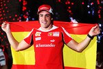 SAKIR, BAHRAIN - MARCH 14:  Fernando Alonso of Spain and Ferrari celebrates in the paddock with team mates after winning the Bahrain Formula One Grand Prix at the Bahrain International Circuit on March 14, 2010 in Sakir, Bahrain.  (Photo by Mark Thompson/Getty Images)