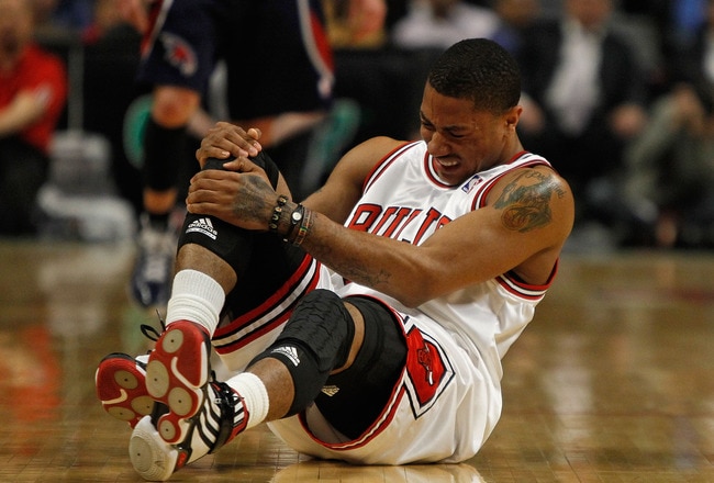 CHICAGO - MARCH 01: Derrick Rose #1 of the Chicago Bulls grabs his knee following collision in the first quarter of a game against the Atlanta Hawks at the United Center on March 1, 2010 in Chicago, Illinois. NOTE TO USER: User expressly acknowledges and agrees that, by downloading and/or using this Photograph, User is consenting to the terms and conditions of the Getty Images License Agreement.  (Photo by Jonathan Daniel/Getty Images)