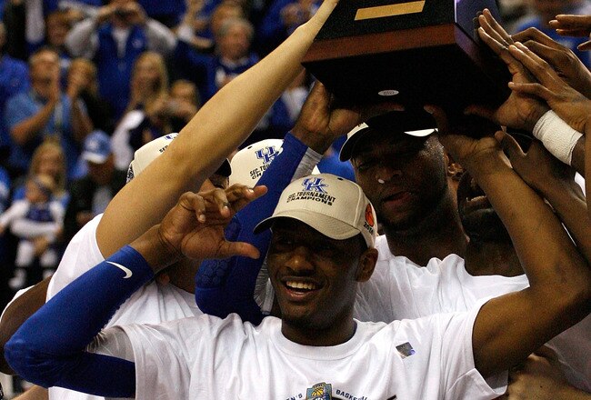 NASHVILLE, TN - MARCH 14:  John Wall #11 (C) of the Kentucky Wildcats celebrates with the trophy after they won 75-74 against the Mississippi State Bulldogs during the final of the SEC Men's Basketball Tournament at the Bridgestone Arena on March 14, 2010 in Nashville, Tennessee.  (Photo by Chris Chambers/Getty Images)