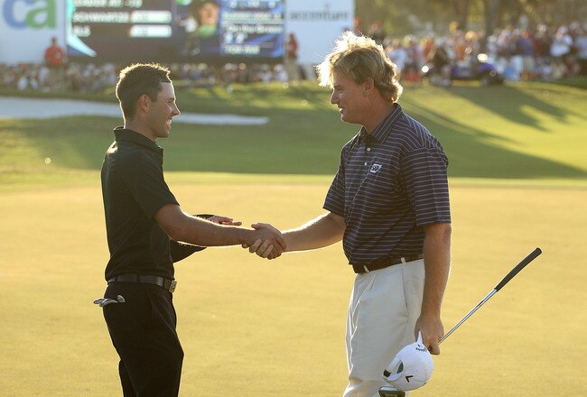 DORAL, FL - MARCH 14:  Charl Schwartzel congrats Ernie Els of South Africa after winning the final round of the 2010 WGC-CA Championship at the TPC Blue Monster at Doral on March 14, 2010 in Doral, Florida.  (Photo by Scott Halleran/Getty Images)