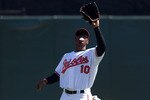 SARASOTA, FL - MARCH 07:  Outfielder Adam Jones #10 of the Baltimore Orioles catches a fly ball against the Boston Red Sox during a Grapefruit League Spring Training Game at Ed Smith Stadium on March 7, 2010 in Sarasota, Florida.  (Photo by J. Meric/Getty Images)
