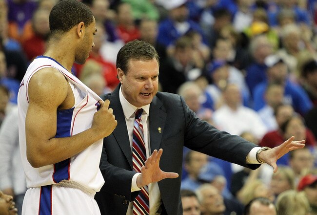 KANSAS CITY, MO - MARCH 13:  Head coach Bill Self of the Kansas Jayhawks instructs Xavier Henry #1 during the 2010 Phillips 66 Big 12 Men's Basketball Championship agaisnt the Kansas State Wildcats on March 13, 2010 at the Sprint Center in Kansas City, Missouri.  (Photo by Jamie Squire/Getty Images)