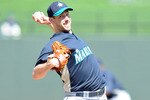 SURPRISE, AZ - MARCH 10:  Cliff Lee #36 of the Seattle Mariners pitches during a spring training game against of the Texas Rangers on March 10, 2010 at Surprise Stadium in Surprise, Arizona.  (Photo by Lisa Blumenfeld/Getty Images)