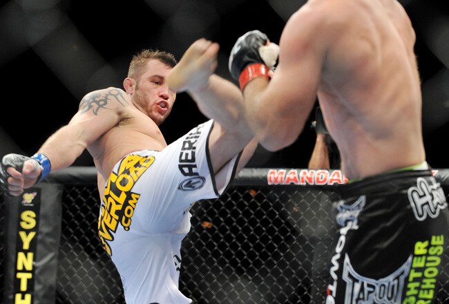 LAS VEGAS - NOVEMBER 21: Brian Foster (L) battles Brock Larson (R) during their Welterweight Fight at the UFC 106 at Mandalay Bay Events Center on November 21, 2009 in Las Vegas, Nevada. (Photo by Jon Kopaloff/Getty Images)