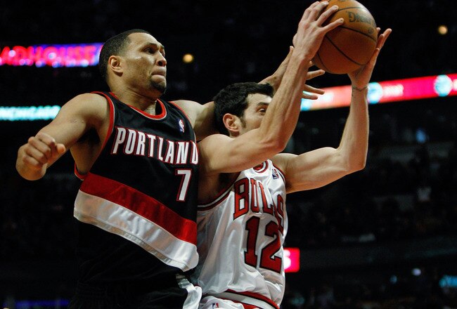 CHICAGO - FEBRUARY 26: Kirk Hinrich #12 of the Chicago Bulls is hit by Brandon Roy #7 of the Portland Trail Blazers whiule shooting at the United Center on February 26, 2010 in Chicago, Illinois. The Bulls defeated the Trail Blazers 115-111 in overtime. NOTE TO USER: User expressly acknowledges and agrees that, by downloading and/or using this Photograph, User is consenting to the terms and conditions of the Getty Images License Agreement. (Photo by Jonathan Daniel/Getty Images)