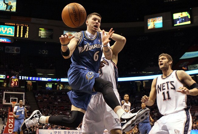 EAST RUTHERFORD, NJ - JANUARY 29:  Mike Miller #6 of the Washington Wizards drives to the net against the New Jersey Nets at the Izod Center on January 29, 2010 in East Rutherford, New Jersey. NOTE TO USER: User expressly acknowledges and agrees that, by downloading and or using this photograph, User is consenting to the terms and conditions of the Getty Images License Agreement.  (Photo by Jim McIsaac/Getty Images)