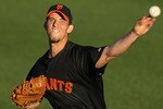 SURPRISE, AZ - MARCH 15:  Starting pitcher Madison Bumgarner #40 of the San Francisco Giants warms up before the MLB spring training game against the Texas Rangers at Surprise Stadium on March 15, 2010 in Surprise, Arizona.  (Photo by Christian Petersen/Getty Images)