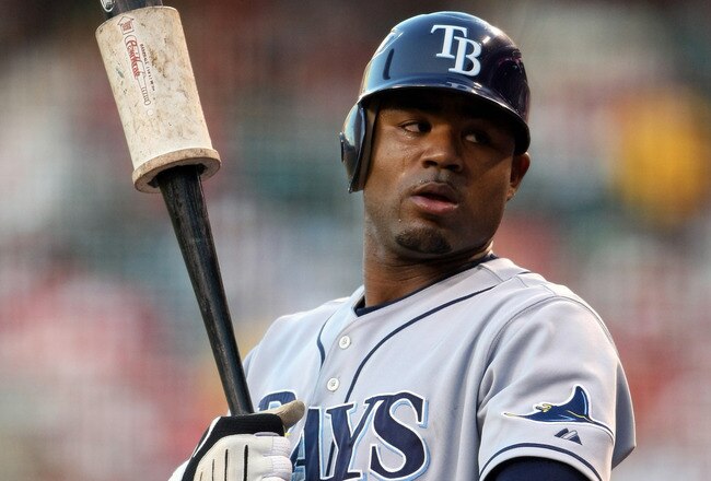 ANAHEIM, CA - AUGUST 11:   Carl Crawford #13 of the Tampa Bay Rays waits on deck in the game with the Los Angeles Angels of Anaheim at Angel Stadium August 11, 2009 in Anaheim, California.   (Photo by Stephen Dunn/Getty Images)