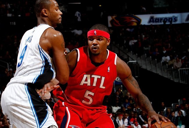 ATLANTA - NOVEMBER 26:  Josh Smith #5 of the Atlanta Hawks against Rashard Lewis #9 of the Orlando Magic at Philips Arena on November 26, 2009 in Atlanta, Georgia.  NOTE TO USER: User expressly acknowledges and agrees that, by downloading and/or using this Photograph, User is consenting to the terms and conditions of the Getty Images License Agreement.  (Photo by Kevin C. Cox/Getty Images)